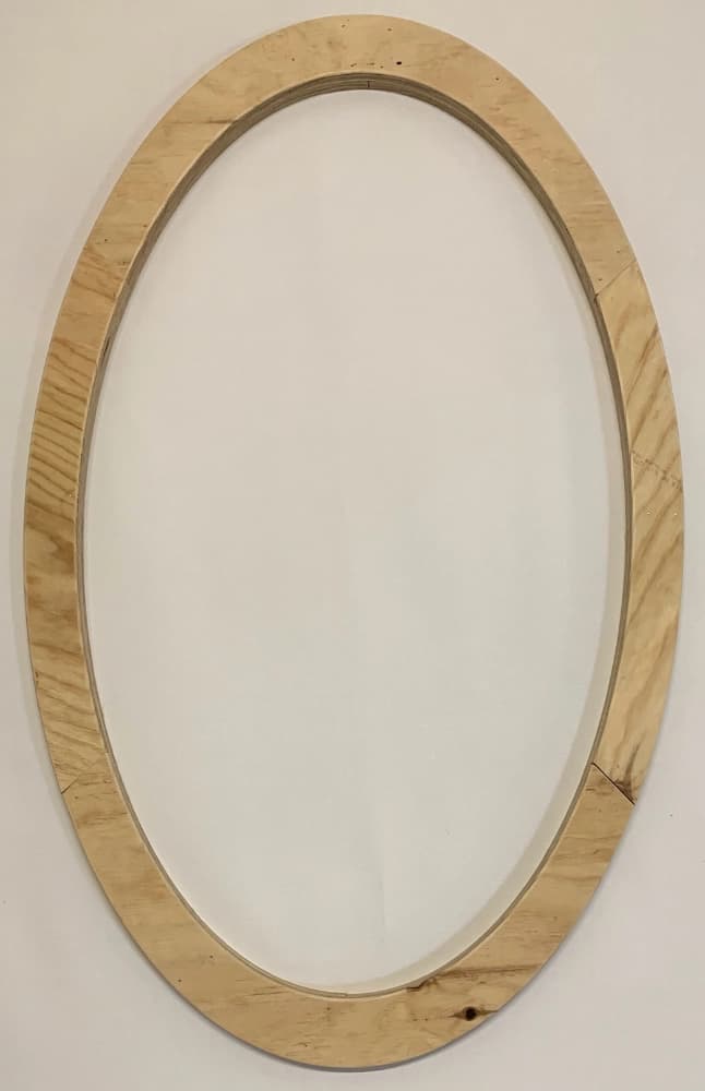 Top view of a custom oval pine wood frame — individually made to specification